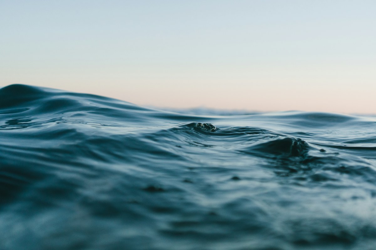 Sunlight over an open blue sea