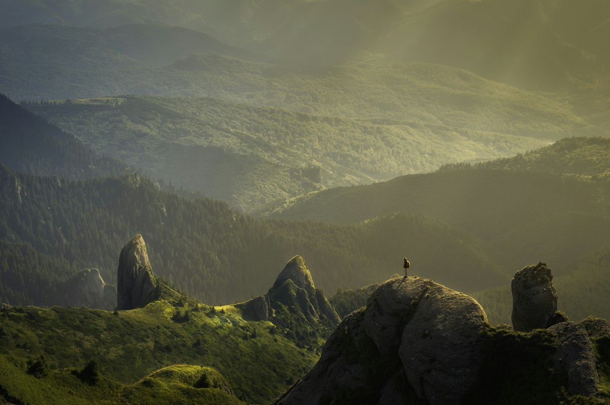 A wide, sunlit mountain valley